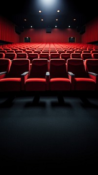 Rows of empty red seats in cinema.  