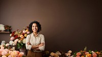 photo of a smiling florist looking at the camera studio shot isolated on a solid background.  