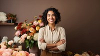 photo of a smiling florist looking at the camera studio shot isolated on a solid background.  