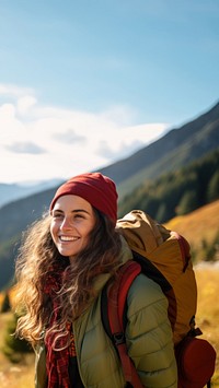 Photo of happy smiling woman hiking in mountains.  