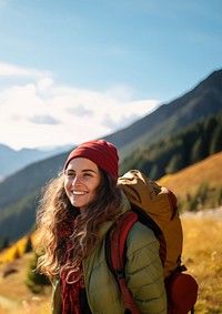 Photo of happy smiling woman hiking in mountains.  