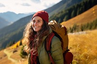 Photo of happy smiling woman hiking in mountains.  