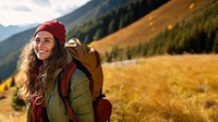 Photo of happy smiling woman hiking in mountains.  