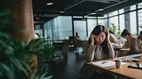 Photo of middle age asian office women having a bad day at office.  