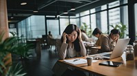 Photo of middle age asian office women having a bad day at office.  