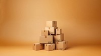 Photo of stacked moving boxes, isolated on beige background.  