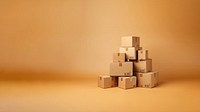 Photo of stacked moving boxes, isolated on beige background.  