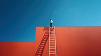 Photography of a man climbing a ladder to the roof.  