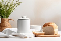 White ceramic jar bread table food. 