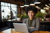 Black business woman laptop computer smiling. 