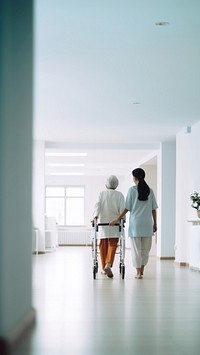 minimal, photo of nurse supporting old woman patient with orthopedic problem to walk in hospital.  