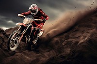 photo of a dirt biker jumping over obstacles.  