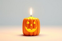 Halloween candle anthropomorphic jack-o'-lantern. 