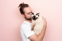 Man holding a cat portrait mammal animal. 