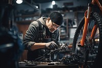 Technician repairing a bicycle metalworking vehicle wheel. 