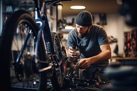 Technician repairing a bicycle vehicle wheel adult. 