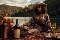 A dark-skinned woman sitting outdoors fashion. 