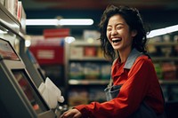 Smiling asian woman paying adult consumerism. 