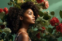 A dark-skinned woman portrait plant flower. 