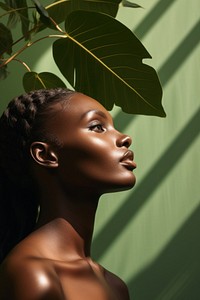 A dark-skinned woman portrait adult plant. AI generated Image by rawpixel.