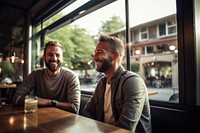 Gay couple photography restaurant laughing. 