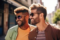 Gay couple laughing outdoors fashion. 