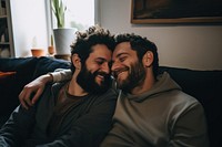 Gay couple smiling adult sofa. 