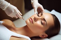 Young woman gets beauty facial injection adult relaxation perfection. 