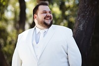 Plus size groom smiling fashion wedding. 