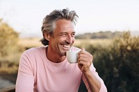 Man drinking tea smiling smile mug. AI generated Image by rawpixel.