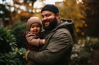 Dad carrying baby photography portrait togetherness. 