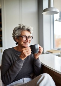 Product photography of a mature woman drinking black coffee while reading newspaper.  