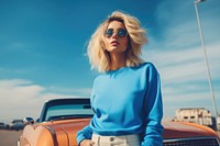 Fashionable confident blonde woman car sunglasses vehicle. 