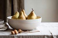 Ceramic bowl background pear fruit. 