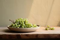 Ceramic plate green grapes background organic. 