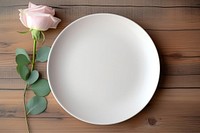 Flower rose white plate mockup wood background. 