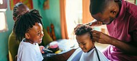 Young boy getting a haircut. AI generated Image by rawpixel.
