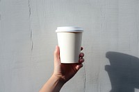 Hand holding takeaway coffee cup. AI generated Image by rawpixel.