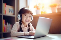 Asian girl student online learning headphones computer laptop. 