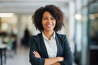 Black woman smiling crossing arms office adult smile. AI generated Image by rawpixel.
