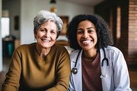 Old woman consulting a woman doctor adult togetherness stethoscope. 