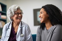 Old woman consulting a woman doctor adult togetherness stethoscope. AI generated Image by rawpixel.