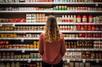 Woman shopping in supermarket. AI generated Image by rawpixel.