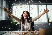 Business woman having fun time confetti sitting party. 