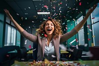 Business woman having fun time confetti sitting party. 