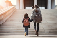 Carrying backpack stairs adult. 