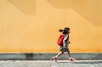 Backpack running child girl. 