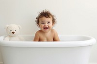 Happy baby bathing bathtub portrait photo. 