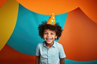 A kid wearing party hat portrait smiling child. 