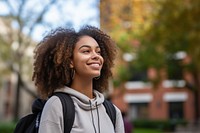 African american college student smile sky architecture. AI generated Image by rawpixel.